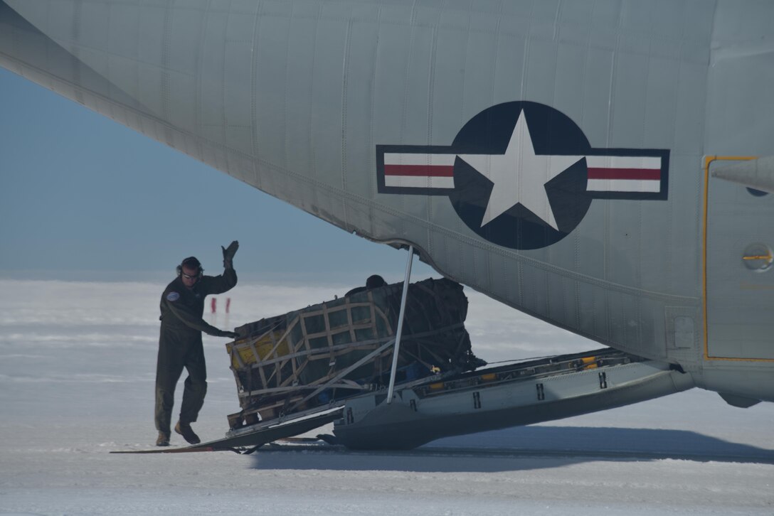 Master Sgt. Randy Powell loads a training pallet onto an LC-130 aircraft here July 28, 2017. Powell is an instructor loadmaster with the 139th Airlift Squadron based out of Stratton Air National Guard Base, Scotia, New York. Raven Camp is used to train aircrews on LC-130 operations on skiways. (U.S. Air National Guard photo by Senior Master Sgt. Willie Gizara/Released)