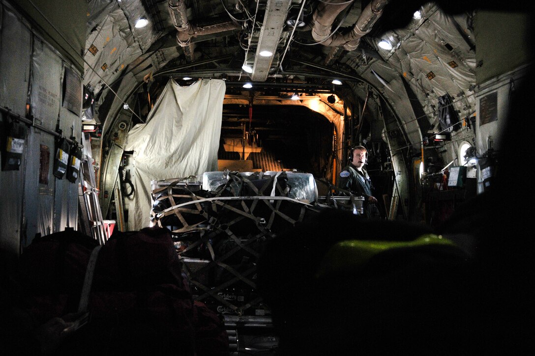 Airman 1st Class Ryan Rhoades fly’s in a LC-130 Skibird to East Greenland Ice Core Project.