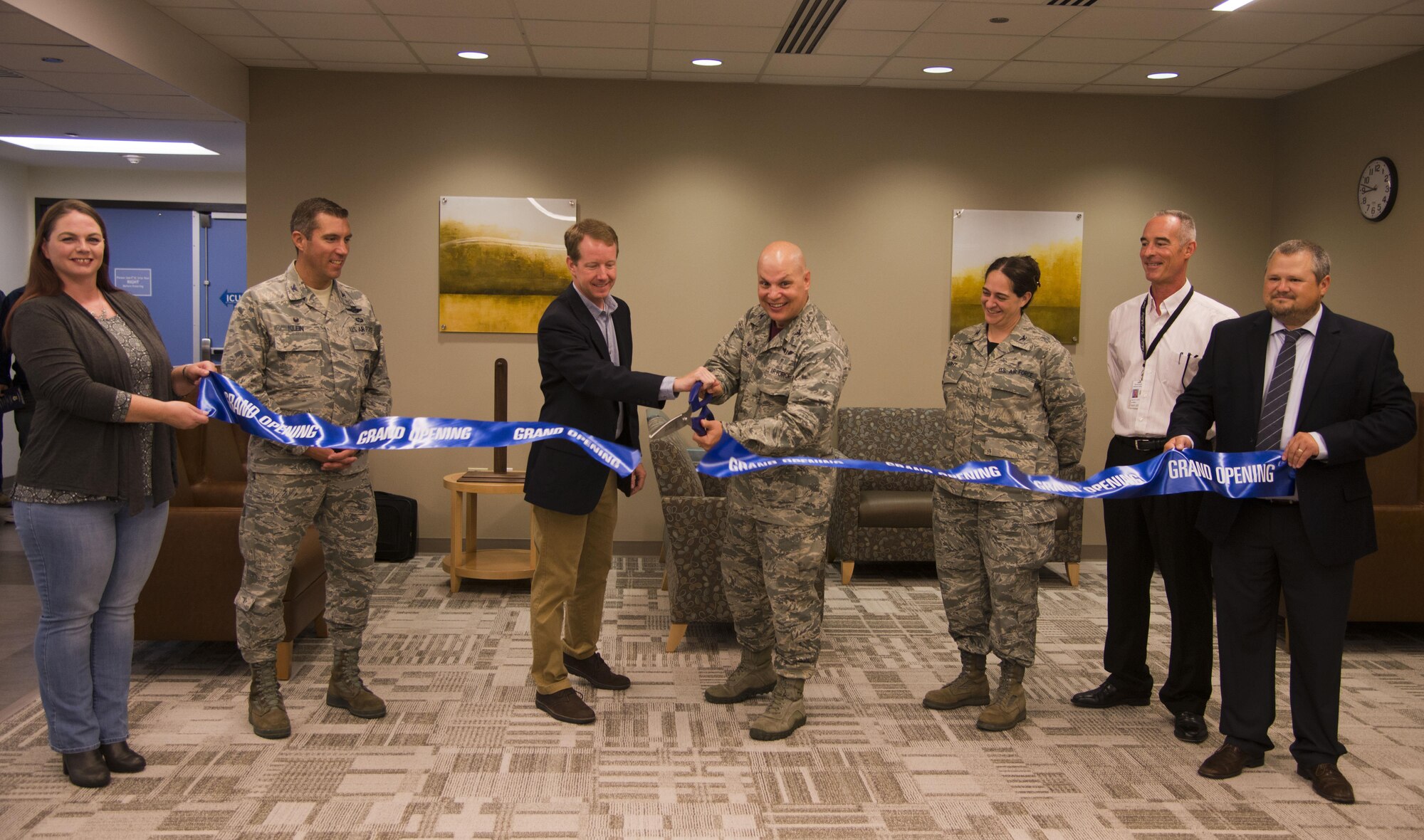 Col. Michael Higgins, 60th Medical Group commander, and Mark Benne, United Excel project manager,center, along with Col. John Klein, 60th Air Mobility Wing commander, left, and Col. Rachel Hight, 60th Surgical Operations Squadron commander, cut the ribbon for the grand opening of the newly renovated surgical center at David Grant USAF Medical Center Aug. 4, 2017.