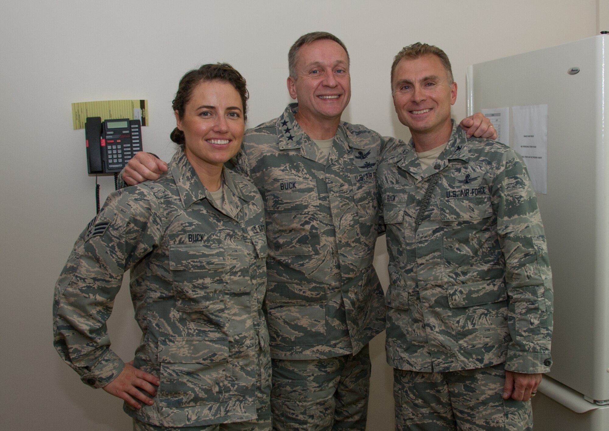 During a tour of the 310th Space Wing, Lt. Gen. David J. Buck, Commander, 14th Air Force (Air Forces Strategic), Air Force Space Command; and Commander, Joint Functional Component Command for Space, U.S. Strategic Command, poses for a photo with Col. Darren Buck, 310th Space Wing vice commander, and Senior Airman Sandra Buck, 310th Force Support Squadron