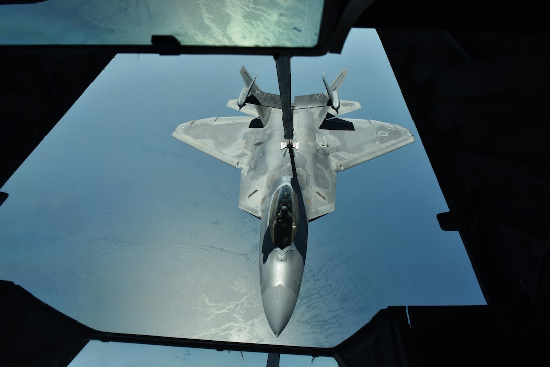 Lt. Gen. Jeffrey L. Harrigian, commander of U.S. Air Forces Central Command, refuels his F-22A Raptor from a KC-10 Extender over the Persian Gulf, June 30, 2017. Harrigian served as the wingman of outgoing 380th Air Expeditionary Wing Commander Brig. Gen. Charles S. Corcoran during his fini-flight. The two generals flew in support of Combined Joint Task Force-Operation Inherent Resolve and the fight against ISIS. (U.S. Air Force photo by Staff Sgt. Marjorie A. Bowlden)
