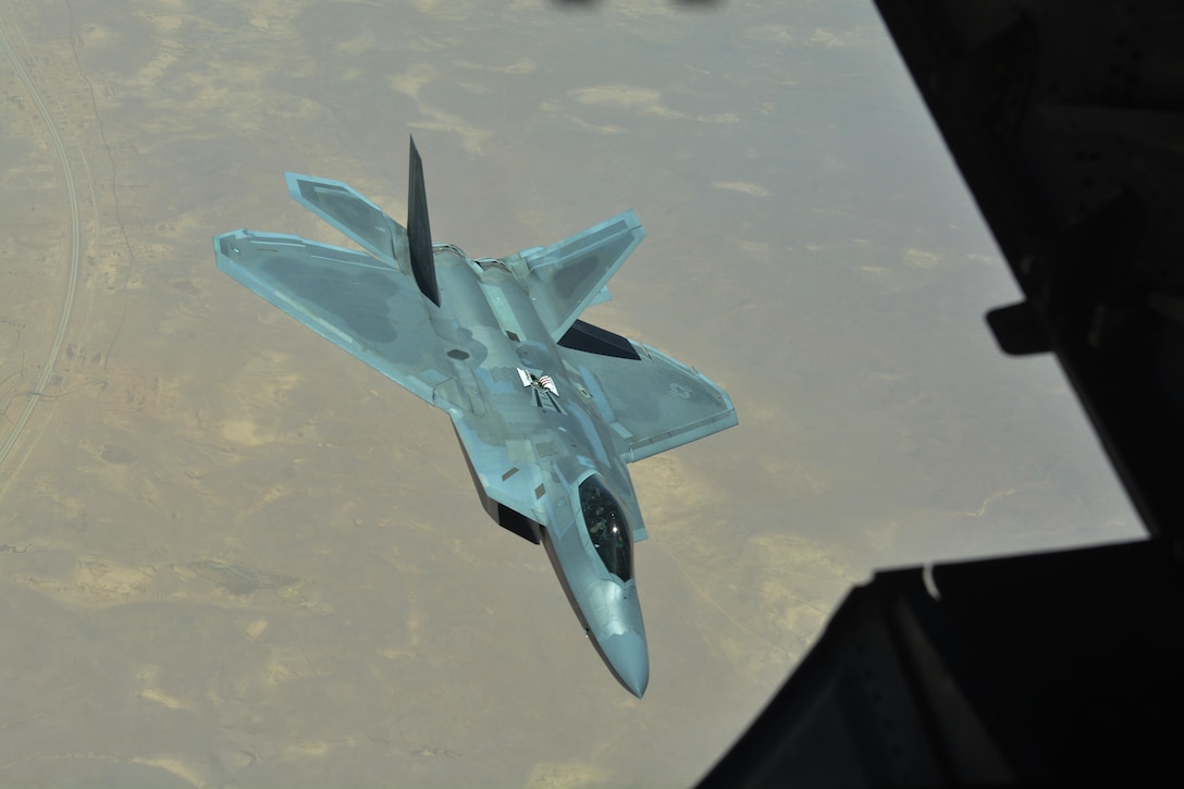 Brig. Gen. Charles S. Corcoran breaks away from a KC-10 Extender after refueling his F-22A Raptor during a sortie over Iraq, June 30, 2017. Corcoran flew his fini flight with U.S. Air Force Central Command Commander Lt. Gen. Jeffrey L. Harrigian in support of Combined Joint Task Force-Operation Inherent Resolve and the fight against ISIS. (U.S. Air Force photo by Staff Sgt. Marjorie A. Bowlden)