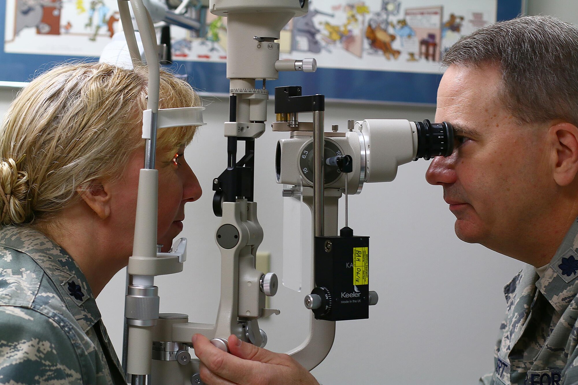 Dr. (Lt. Col.) Donald Seibert, 445th Aerospace Medicine Squadron optometry flight chief, conducts an eye exam on Lt. Col. Lisa Shear, 445th Aerospace Medicine Squadron chief nurse, for a Periodic Health Assessment Services Blood Program here July 15, 2017.