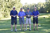 (Left to right) Dave Marien, Larry Shaw, 434th Air Refueling Wing commander, Paul Weitbrock and Taylor Smith pose for a photo at a local golf course in Peru, Ind., July 29, 2017. The golf scramble raised money for the upcoming Air Force Ball. (U.S. Air Force photo/ Senior Airman Cali Wetli)