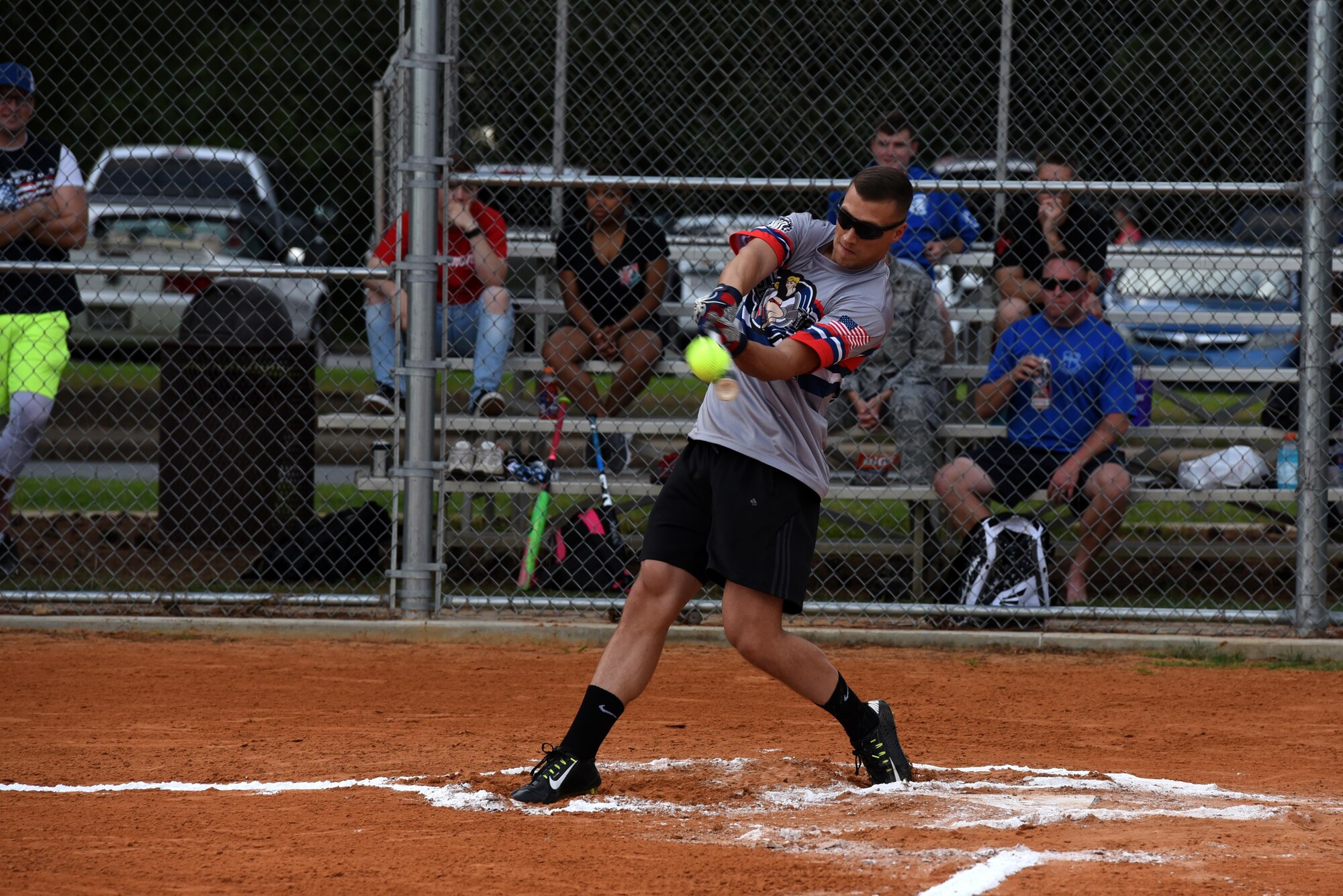 Senior Airman Aaron Elmore, 19th Operations Support Squadron air traffic controller, hits a softball during the 2017 Softball All-Star Day Home Run Derby Aug. 3, 2017, at Little Rock Air Force Base, Ark. Each competitor had 10 minutes and two rounds to hit as many home runs as possible. (U.S. Air Force photo by Senior Airman Mercedes Taylor)