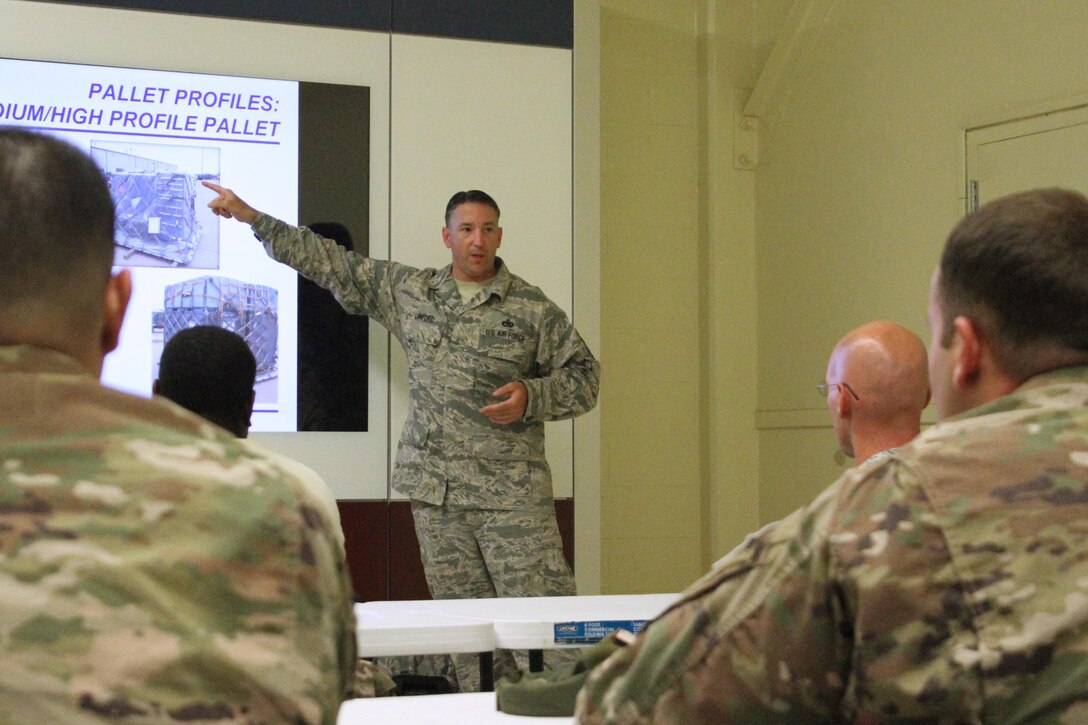 Master Sgt. William Linford, air terminal manager at Joint Base Langley-Eustis, Virginia, conducts a class on pallet buildup