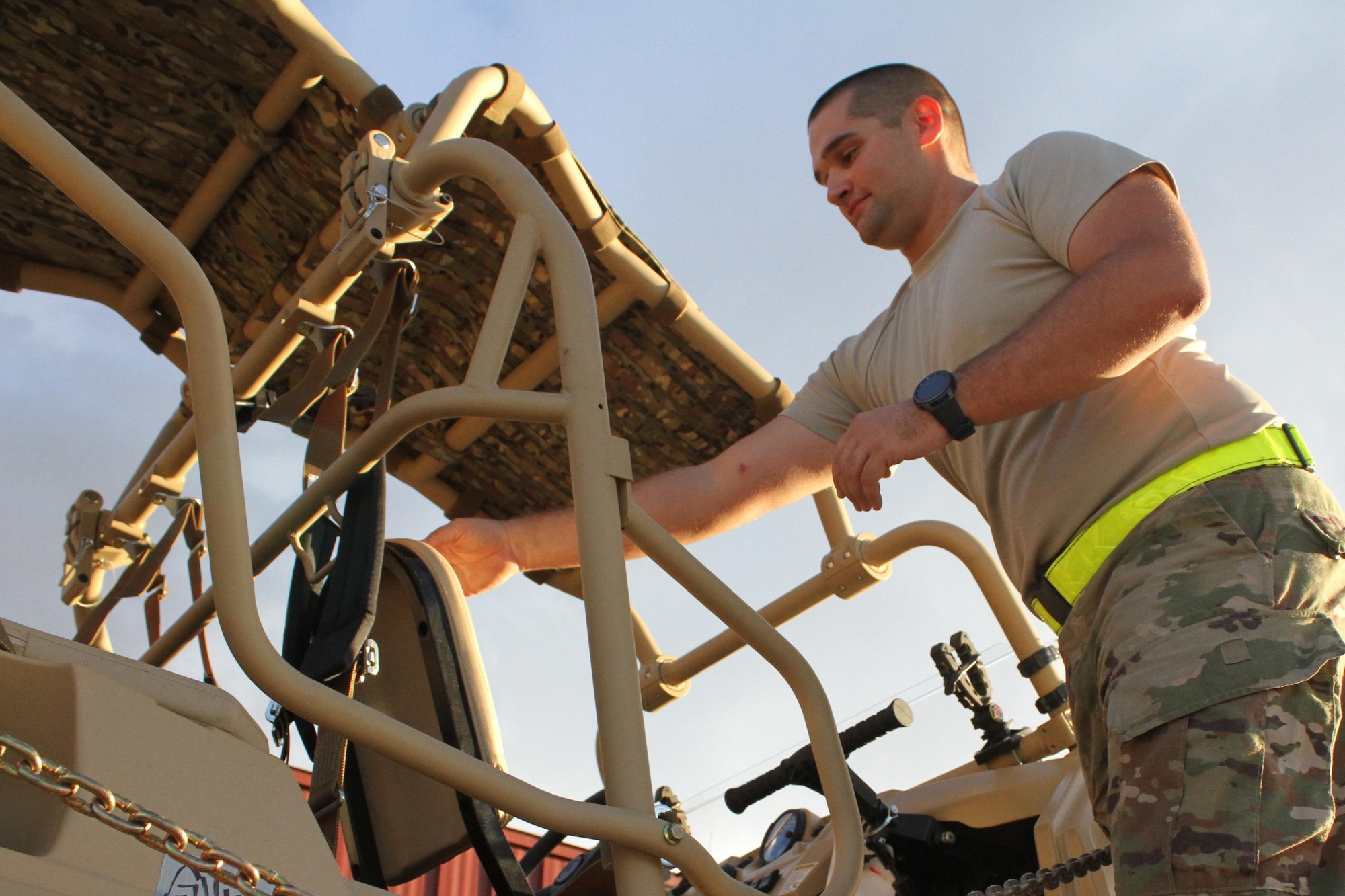 Senior Airman Brian Jackson, Air Force Security Forces Center Desert Defender Ground Combat Readiness Training Center's Logistics Detail team member, checks to make sure an MRZR off-road utility vehicle is ready for shipment.