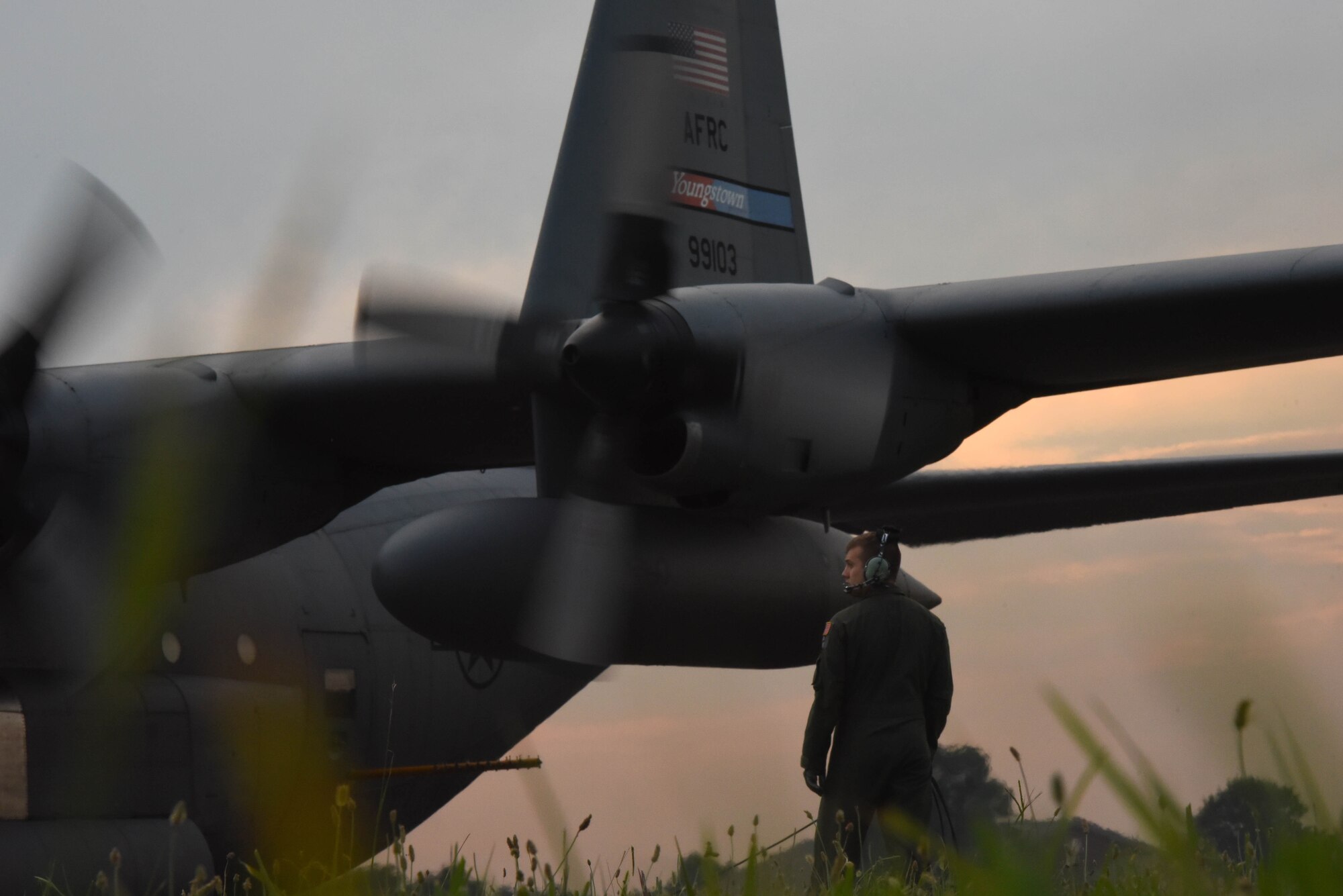 U.S. Air Force Staff Sgt. Bradley Hutchison, a 757th Airlift Squadron aerial spray team technician, assists in engine start-up during a mosquito spraying mission at Joint Base Langley-Eustis, Virginia, August 1, 2017.