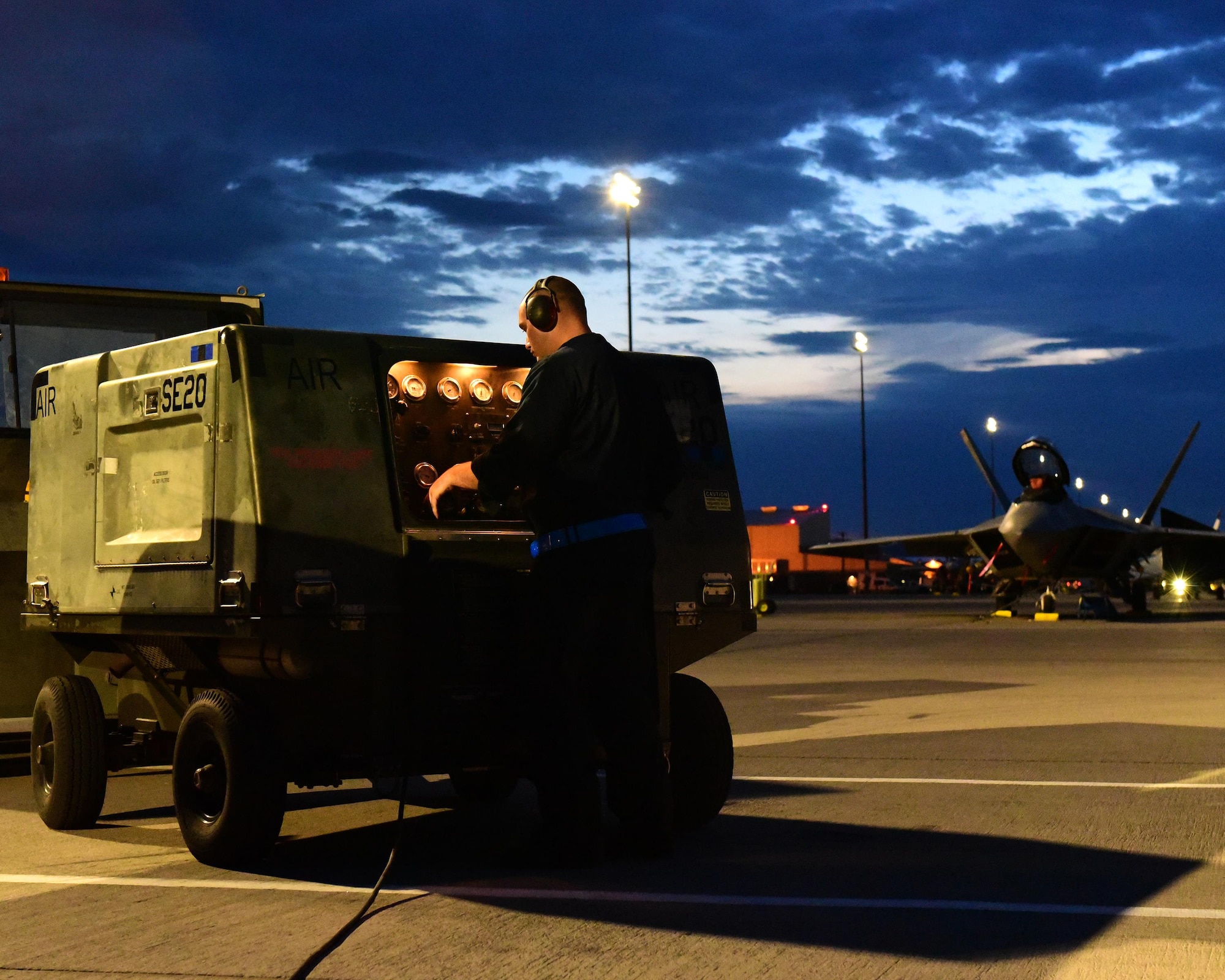 U.S. Air Force Senior Airman Elizah Morgan, 325th Aircraft Maintenance Squadron, Tyndall Air Force Base, Fla., F-22 Raptor crew chief, starts up maintenance equipment used on the F-22 at Nellis Air Force Base, Nev., July 18, 2017. Airmen from Tyndall took part in Red Flag 17-3, an exercise that allows advanced training for aircraft combat units.