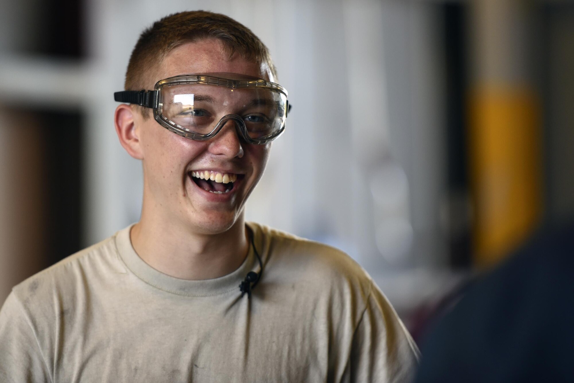 Airman 1st Class Charles Price, 23d Logistics Readiness Squadron vehicle maintenance specialist, shares a laugh during an interview as part of the ‘A Closer Look’ video series, July 13, 2017, at Moody Air Force Base, Ga. The series shows 23d WG PA broadcasters experiencing the grit and grime of several trades for Airmen to better understand and appreciate different missions. To watch the series, stay tuned for the premier on the Moody Facebook page and www.moody.af.mil, August 15. (U.S. Air Force photo by Senior Airman Greg Nash)