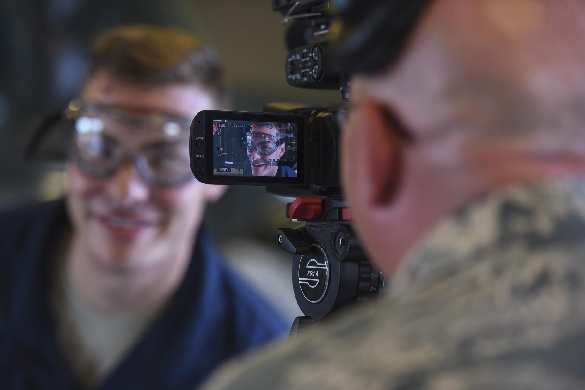 Tech. Sgt. Timothy Gallagher, 23d Wing Public Affairs broadcaster, records fellow broadcaster Senior Airman Kyle Saunders as he performs as an interim vehicle maintenance specialist,  during the ‘A Closer Look’ video series, July 13, 2017, at Moody Air Force Base, Ga. The series shows 23d WG PA broadcasters experiencing the grit and grime of several trades for Airmen to better understand and appreciate different missions. To watch the series, stay tuned for the premier on the Moody Facebook page and www.moody.af.mil, in August 15. (U.S. Air Force photo by Senior Airman Greg Nash)