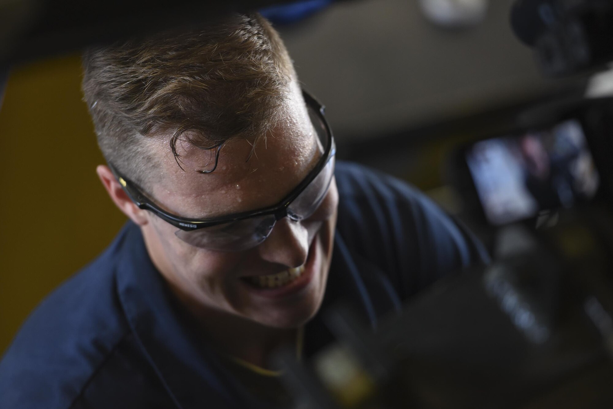 Senior Airman Kyle Saunders, 23d Wing Public Affairs broadcaster, tightens a bolt during the ‘A Closer Look’ series, July 13, 2017, at Moody Air Force Base, Ga. The series shows 23d WG PA broadcasters experiencing the grit and grime of several trades for Airmen to better understand and appreciate different missions. To watch the series, stay tuned for the premier on the Moody Facebook page and www.moody.af.mil, August 15. (U.S. Air Force photo by Senior Airman Greg Nash)