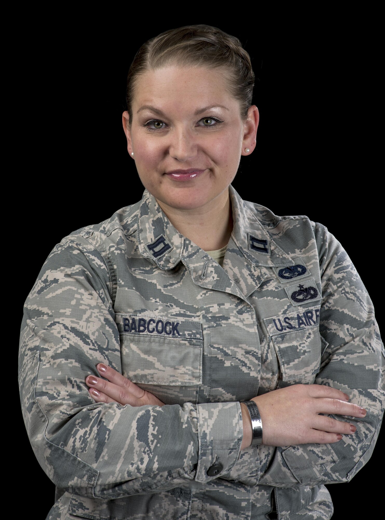 Capt. Leanne Babcock, 349th Logistics Readiness Squadron, operations officer, displays the tokens that she always keeps near, July 27, 2017 Travis Air Force Base, Calif. Men and women serving their country in all branches of the military have traditionally kept meaningful mementos or talismans close to them for good luck, as reminders, to bring comfort or other deeply felt personal reasons. (U.S. Air Force photo/ Heide Couch)