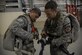 Colombian Air Force members, suit-up for a multinational personnel airdrop from a Colombian Casa 295 aircraft during Exercise Mobility Guardian at Joint Base Lewis-McChord, Wash., Aug. 6, 2017. Nineteen multinational service members from Colombia, France and Pakistan jumped out of a Casa 295 at Larson, Wash. (U.S. Air Force photo/Staff Sgt. Angela Ruiz)