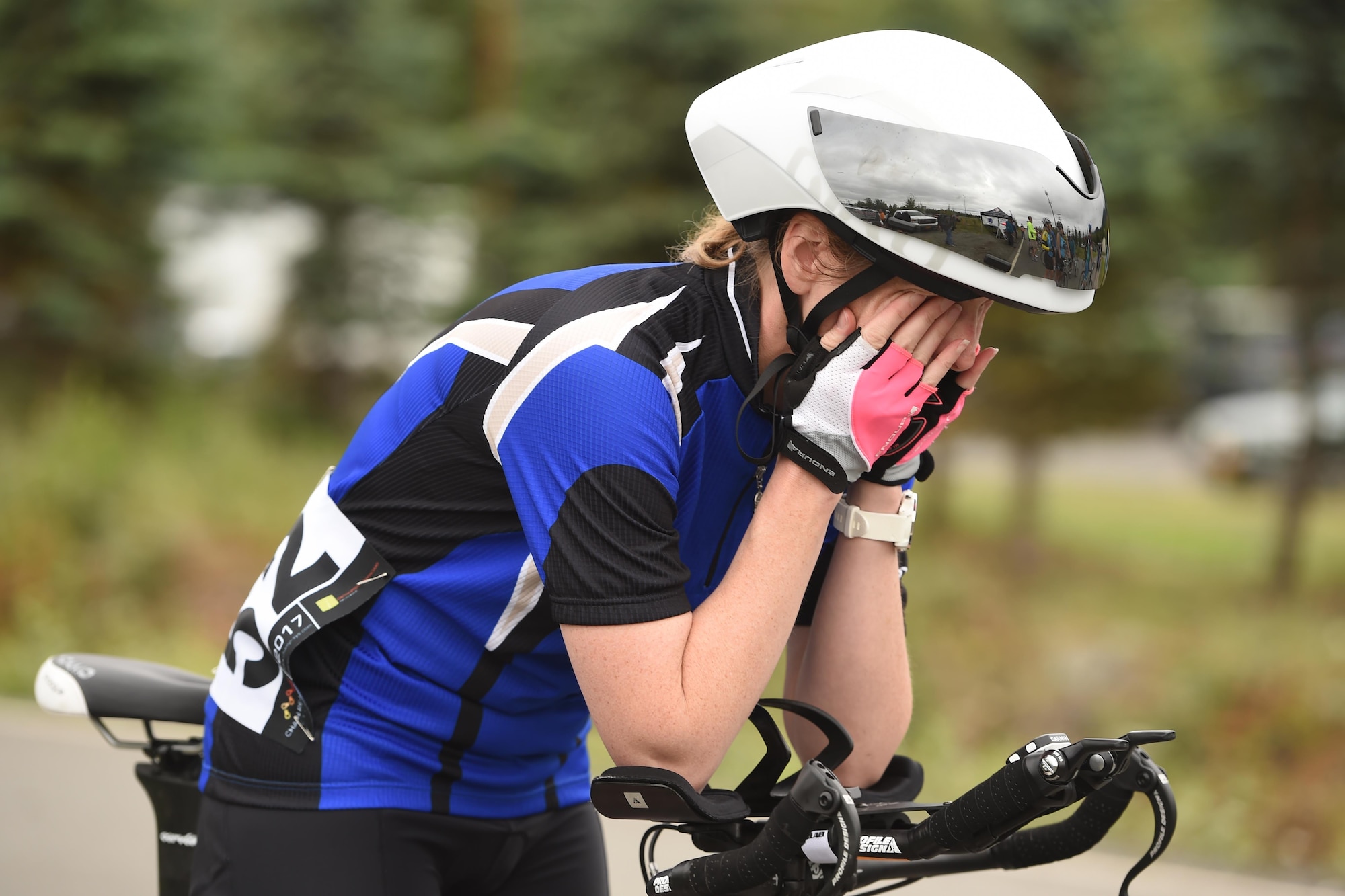 Joanne Allen wipes her face before the Moose Run time-trial race at Moose Run Golf Course at Joint Base Elmendorf-Richardson, Alaska, Aug. 3, 2017. For more than 15 years, the club has hosted road race events at JBER.
