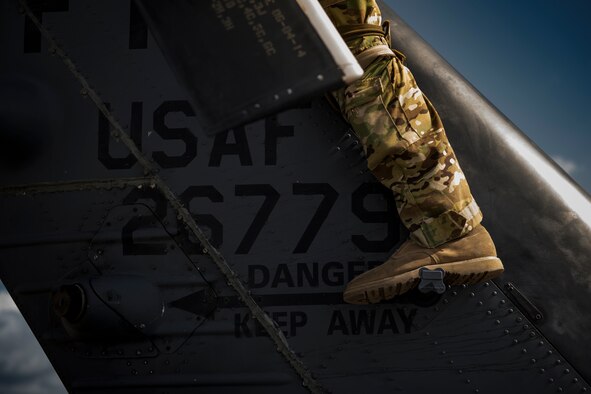 A special missions aviator descends the tail of an HH-60G Pave Hawk as part of pre-flight inspections, Aug. 7, 2017, at Moody Air Force Base, Ga.