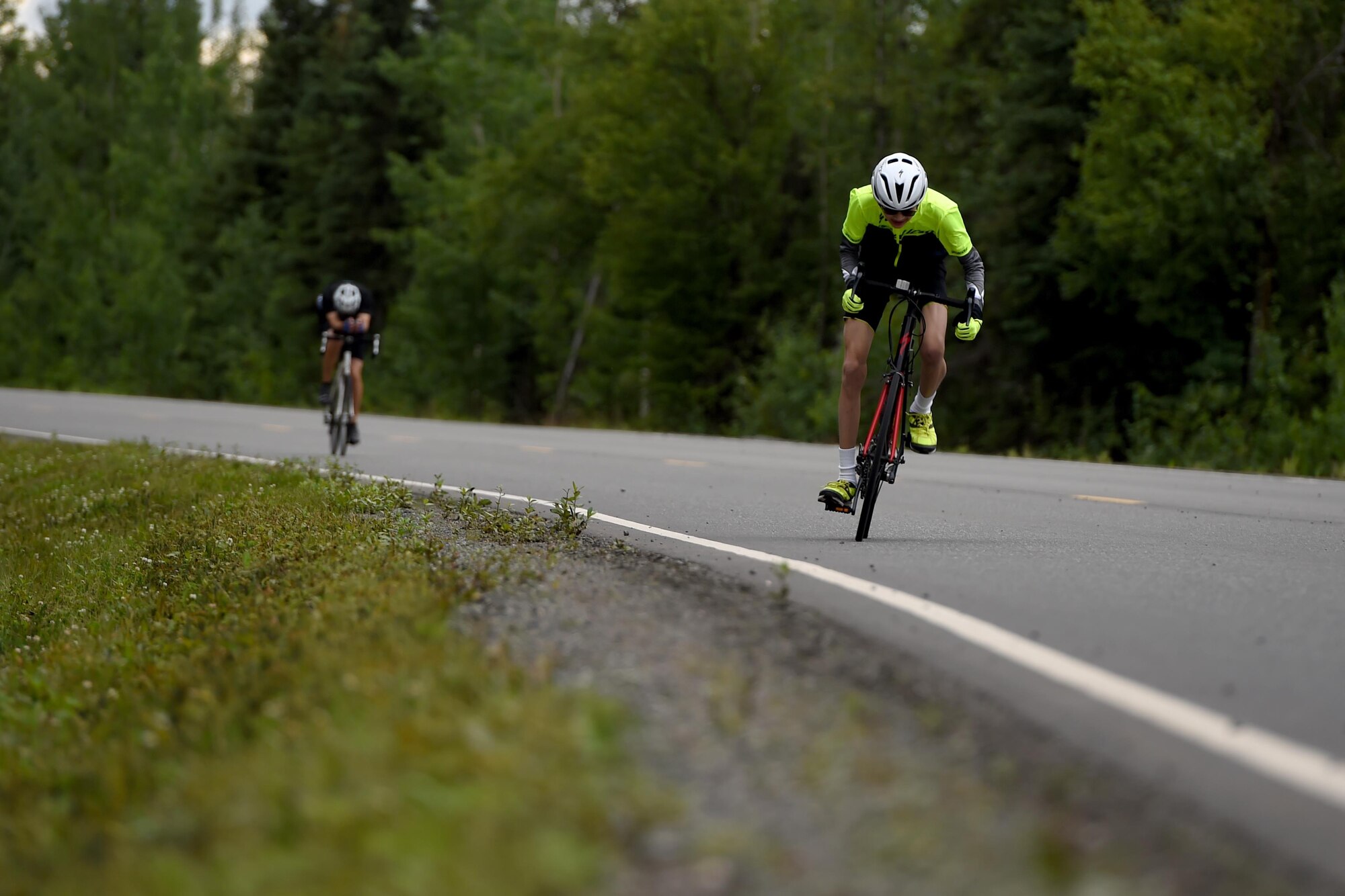 Cyclists race toward the finish line during the Moose Run time-trial race at Moose Run Golf Course at Joint Base Elmendorf-Richardson, Alaska, Aug. 3, 2017. For more than 15 years, the club has hosted road race events at JBER.