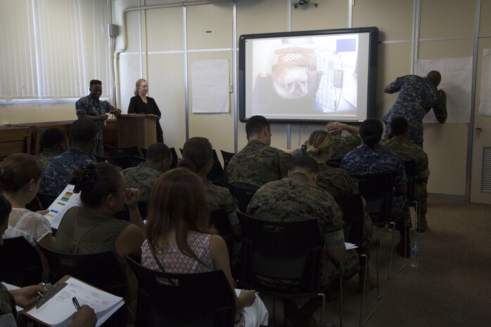 A volunteer writes out different natural hazards during an Emergency Preparation class July 28 at the 3rd Dental Battalion building aboard Camp Foster, Okinawa, Japan.