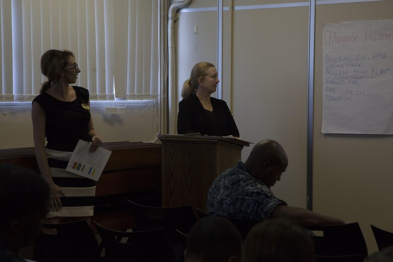 Natalie Wooley, left, and Darlene Robinson talk to the class about different man-made hazards during an Emergency Preparation class July 28 at the 3rd Dental Battalion building aboard Camp Foster, Okinawa, Japan.