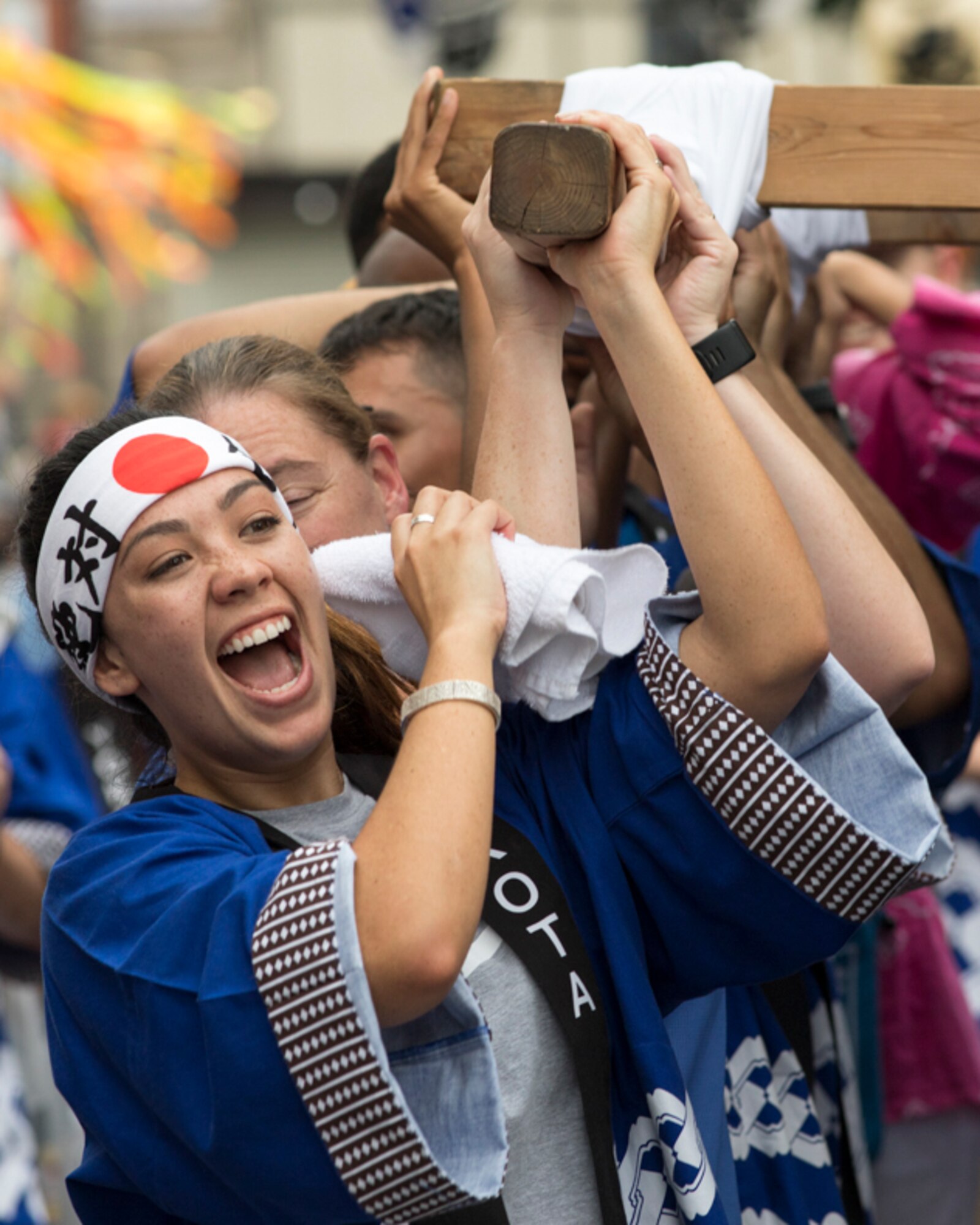 Airmen from Yokota Air Base carry the wing mikoshi during the 67th Annual Fussa Tanabata Festival