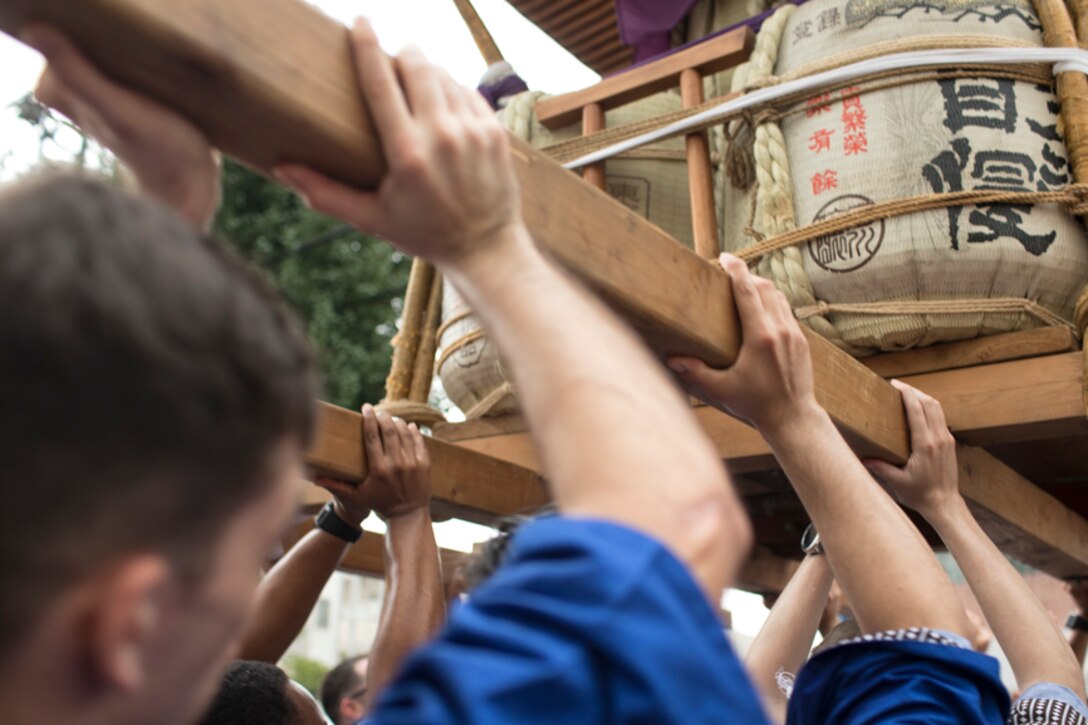 Members from Yokota Air Base carry the wing mikoshi