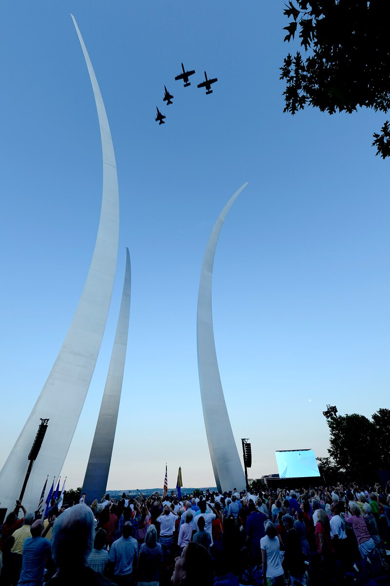 A four-ship formation flies over the Air Fore Memorial during the final 2017 Heritage to Horizons summer concert series, performed by the Air Force Band, in Arlington, Va., Aug. 4, 2017. (U.S Air Force photo/Senior Airman Rusty Frank)