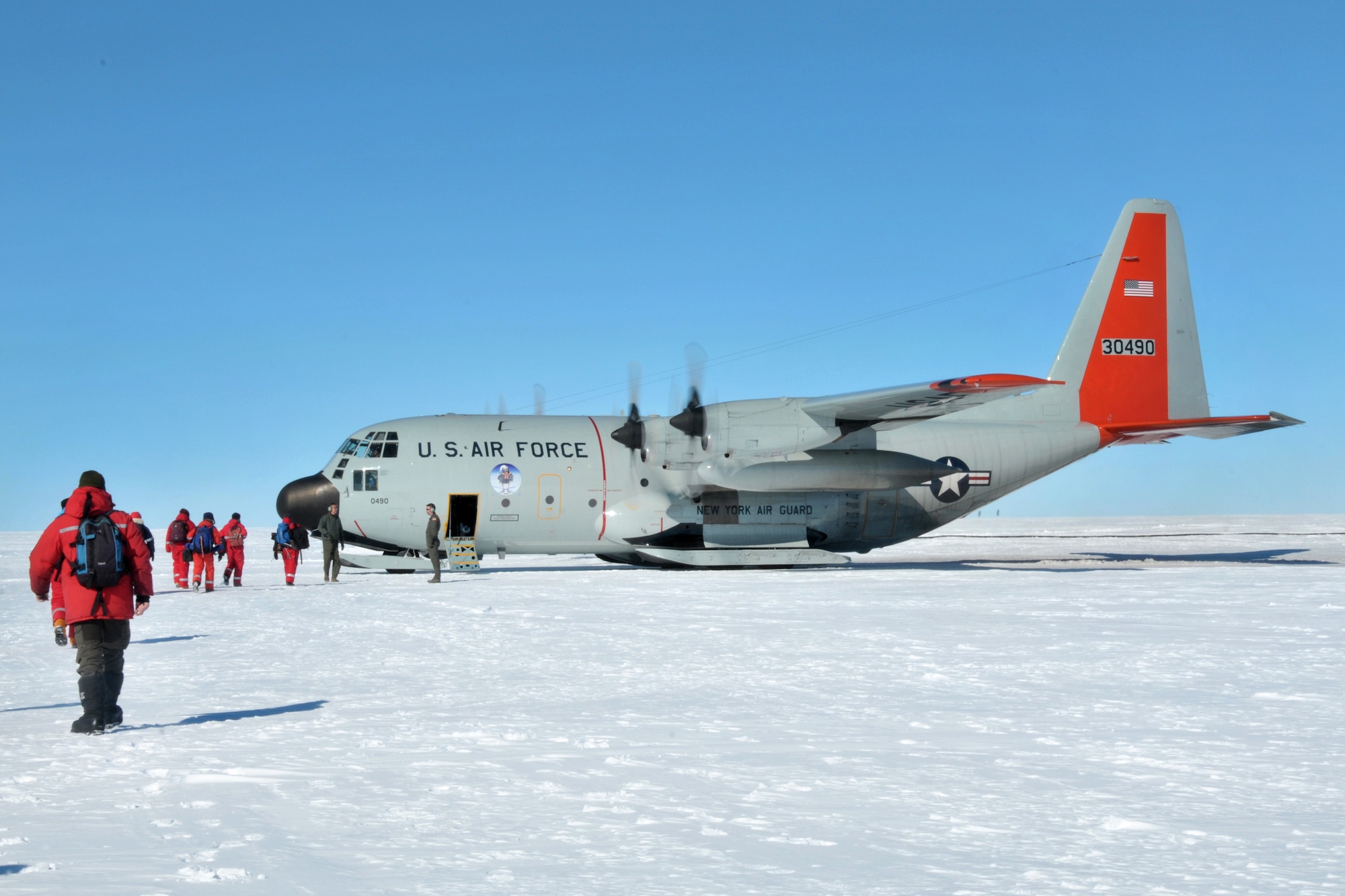 Scientists board a LC-130 Skibird.