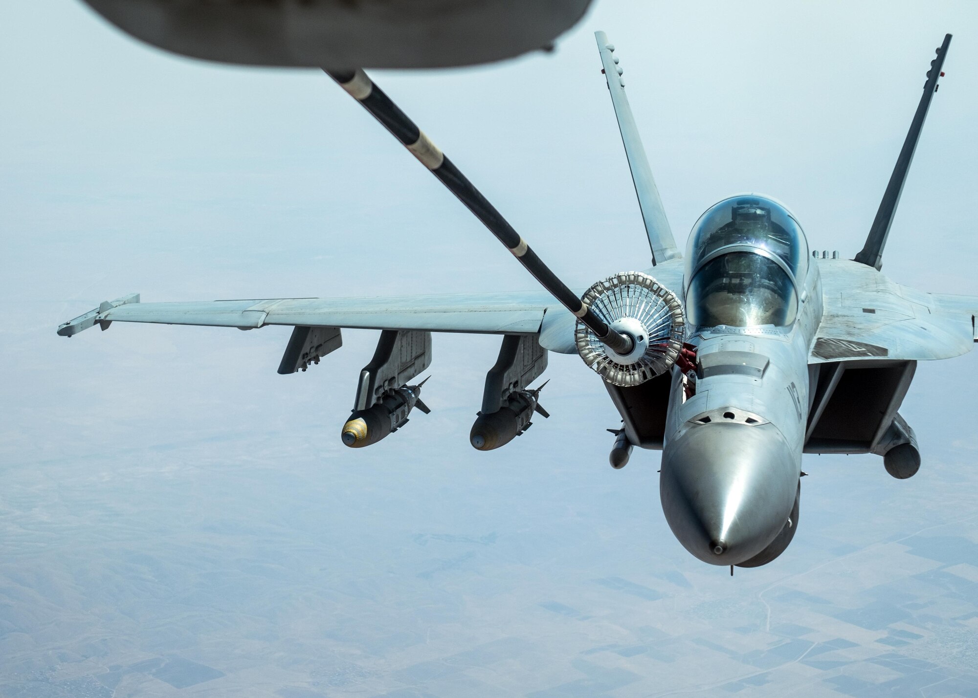 A U.S. Navy F/A-18 Super Hornet receives fuel from a KC-10 Extender with the 908th Expeditionary Air Refueling Squadron August 2, 2017, above southwest Asia.