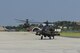 Two U.S. Army AH-64 Apache helicopters land at Kunsan Air Base, Republic of Korea, Aug. 7, 2017 while an F-16 Fighting Falcon taxis behind them. The 4- 2 ARB distribution platoon participated in a joint Forward Arming and Refueling Point to support their battalion’s aircraft during a live-fire air-to-sea interdiction and attack exercise near Kunsan. (U.S. Air Force photo by Senior Airman Michael Hunsaker/released)