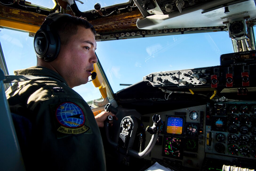 A pilot checks the surrounding air space around his aircraft.