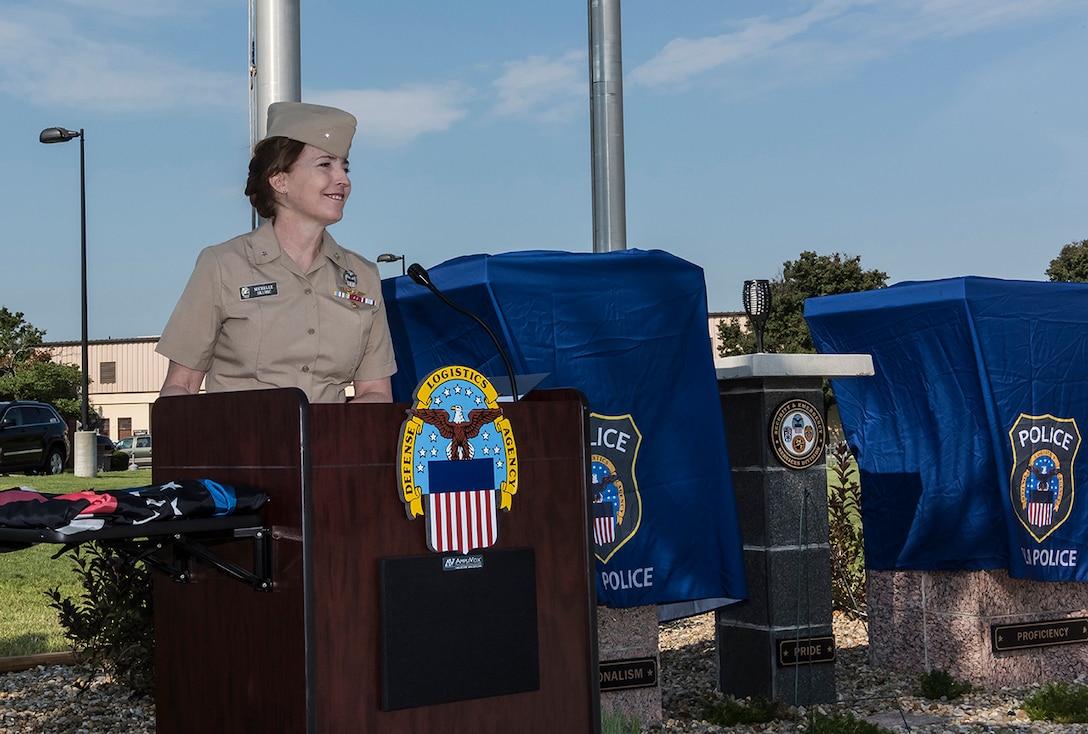 DLA Land and Maritime Commander Navy Rear Adm. Michelle Skubic speaks at the dedication of the Police and Fire Memorial at Defense Supply Center Columbus.