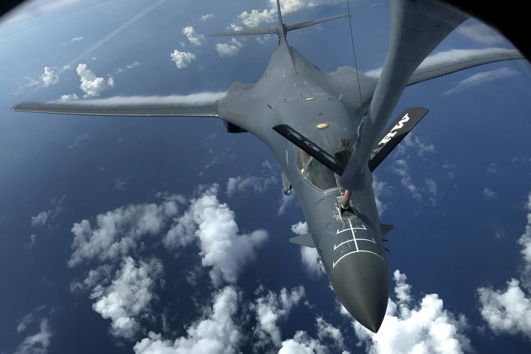 An aircraft is refueled in flight.