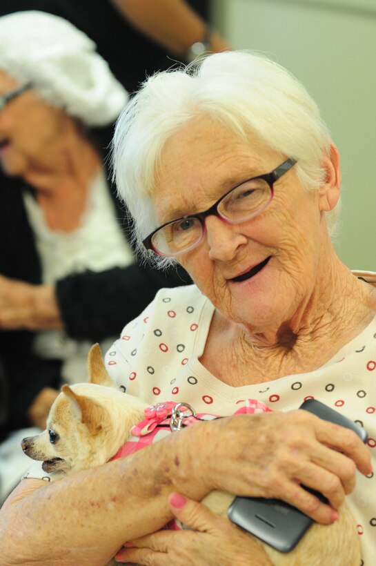 Sheila Barnes, a resident of a local senior care home, holds Naomi Watts during a visit from Frankie & Andy's Place July 27, 2017, Winder, Ga. Naomi is a senior dog that was rescued by Frankie & Andy's Place and visits senior citizens to liven up their day