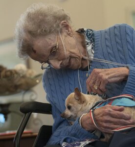 Mary Sandstrum, a resident of a local senior care home, pets Naomi Watts during a visit from Frankie & Andy's Place July 27, 2017, Winder, Ga. Naomi is a senior dog that was rescued by Frankie & Andy's Place and visits senior citizens to liven up their day.