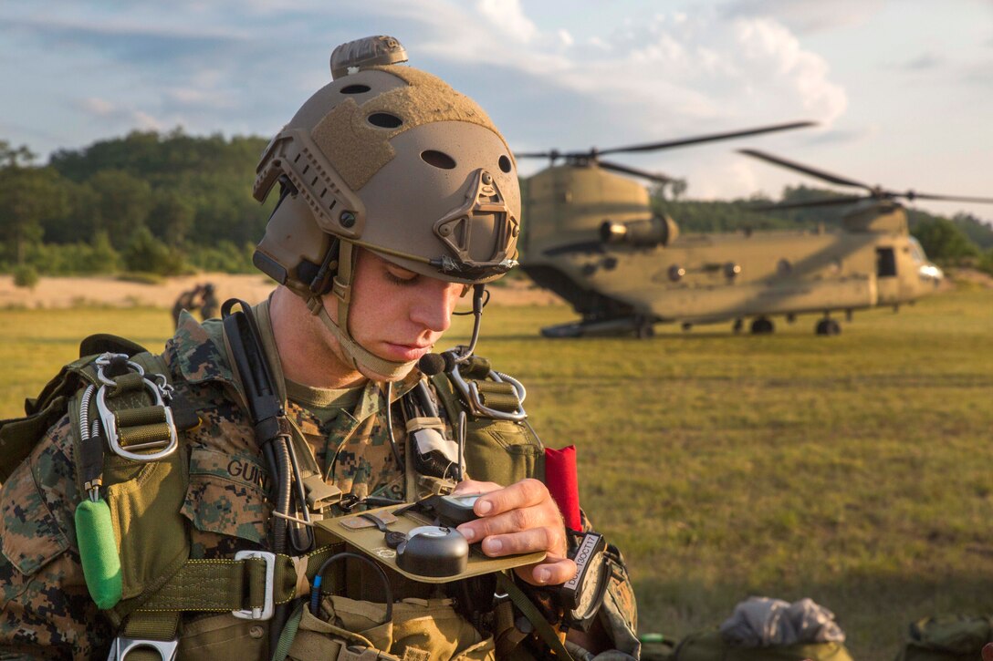 A Marine checks his equipment before conducting high altitude, high opening jump operations.