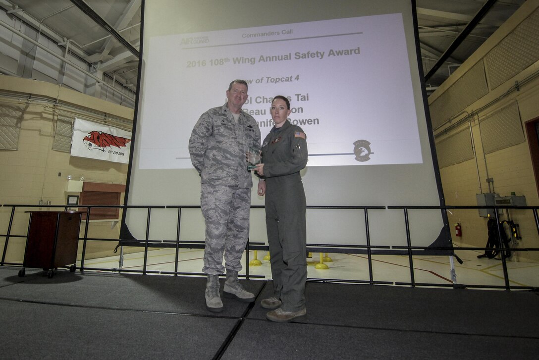 U.S. Air Force Col. Andrew P. Keane, left, Commander of the New Jersey Air National Guard's 108th Wing, presents Master Sgt. Jennifer Bowen with the 108th Wing Annual Safety Award during the annual Commander's Call event at Joint Base McGuire-Dix-Lakehurst, N.J., Aug. 6, 2017. (U.S. Air National Guard photo by Master Sgt. Matt Hecht/Released)