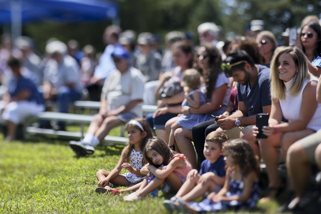 Friends and family of Air National Guard Lt. Col. Paul Giblin listen to 108th Wing members share their memories of him during a KC-135 Stratotanker static display naming event on Joint Base McGuire-Dix-Lakehurst, N.J., Aug. 5, 2017.