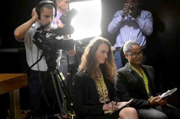 This is an image of a group of high school students conducting an interview.