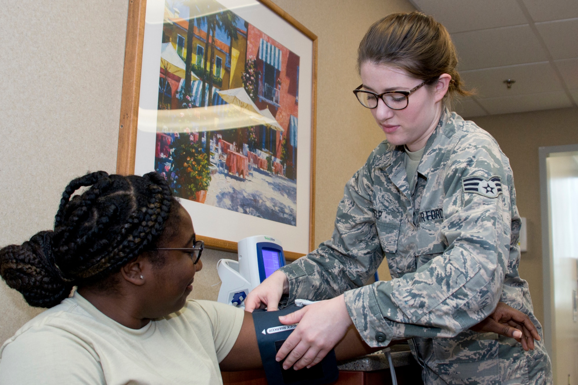 U.S. Air Force Reserve Senior Airman Alexandra Delp, a 913th Aerospace Medical Squadron dental technician, takes the blood pressure of Senior Airman Arnetta Porter, an air transportation journeyman assigned to the 96th Aerial Port Squadron, before her dental examination during the Unit Training Assembly weekend at Little Rock Air Force Base, Ark., Aug. 5, 2017. The medical squadron helps ensure 913th Airlift Group Airmen meet medical requirents to be deployed worldwide. (U.S. Air Force photo by Master Sgt. Jeff Walston/Released)