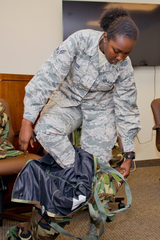U.S. Air Force Reserve Airman 1st Class Daja Dyson, command support staff, 913th Airlift group, tries on protective JSLIST (Joint Service Lightweight Integrated Suit Technology) garments for sizing during the Unit Training Assembly weekend at Little Rock Air Force Base, Ark., Aug. 5, 2017. The JSLIST is a chemical protective clothing ensemble including a lightweight CB protective garment, multi-purpose overboots and gloves. (U.S. Air Force photo by Master Sgt. Jeff Walston/Released)