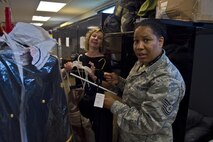 Christy Shives, Airman and Family Readiness violence prevention coordinator, and Tech. Sgt. Soyica Stanfield, A&FR technician, organize donated dresses at Airman and Family Readiness, Grissom Air Reserve Base, Ind., July 8, 2017. Airman and Family Readiness has been accepting donations of formal dresses to be used by Airmen’s wives and girlfriends for the upcoming Air Force Ball. (U.S. Air Force photo/Senior Airman Harrison Withrow)