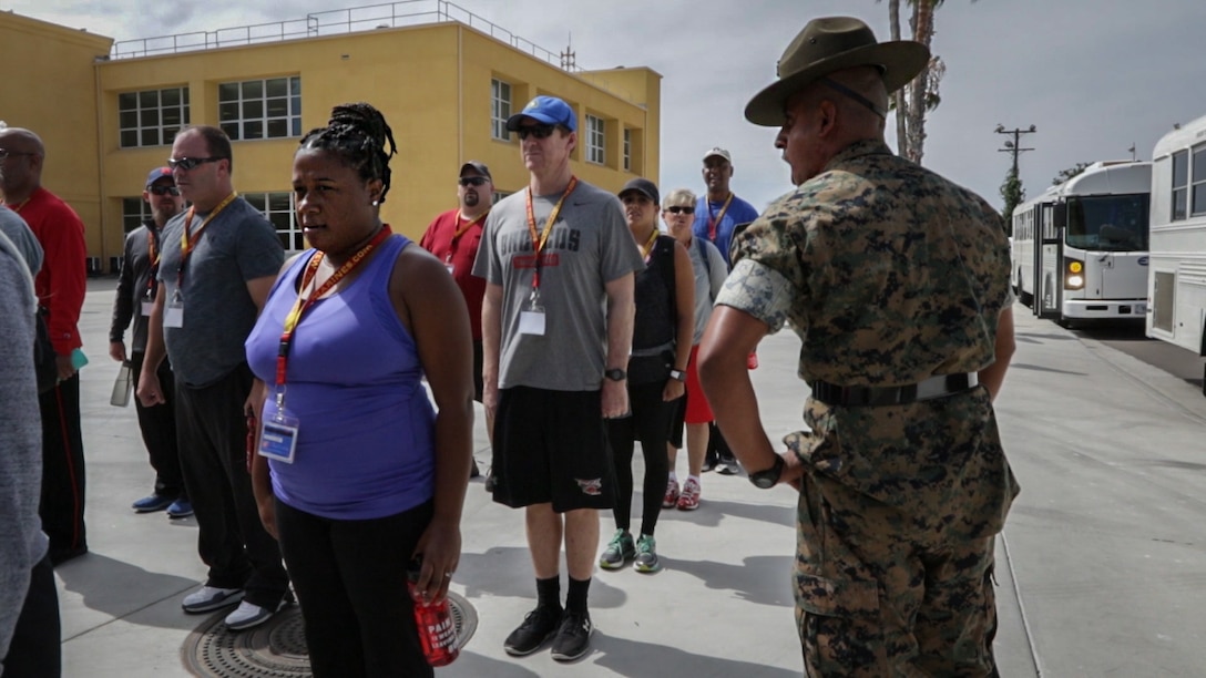 High school educators from Fort Worth, Texas are formed up for movement during the Educator's Workshop on Marine Corps Recruit Depot San Diego, Calif., Aug. 8, 2017. The workshop is a four-day program designed to better inform high school and college educators about the benefits and opportunities available during service in the Marine Corps. This allows the attendees to return to their place of business and provide firsthand experience and knowledge to individuals interested in military service. (Marine Corps photo by Sgt. Danielle Rodrigues/Released)