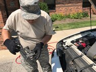 Tech. Sgt. Joseph Main, 434th Civil Engineer Squadron power production noncommissioned officer in charge, checks oil levels as part of a free vehicle inspection at Grissom Air Reserve Base, Ind., July 5, 2017. The inspection is done to ensure the safety of Airman at Grissom. (U.S. Air Force photo/Senior Airman Cali Wetli)