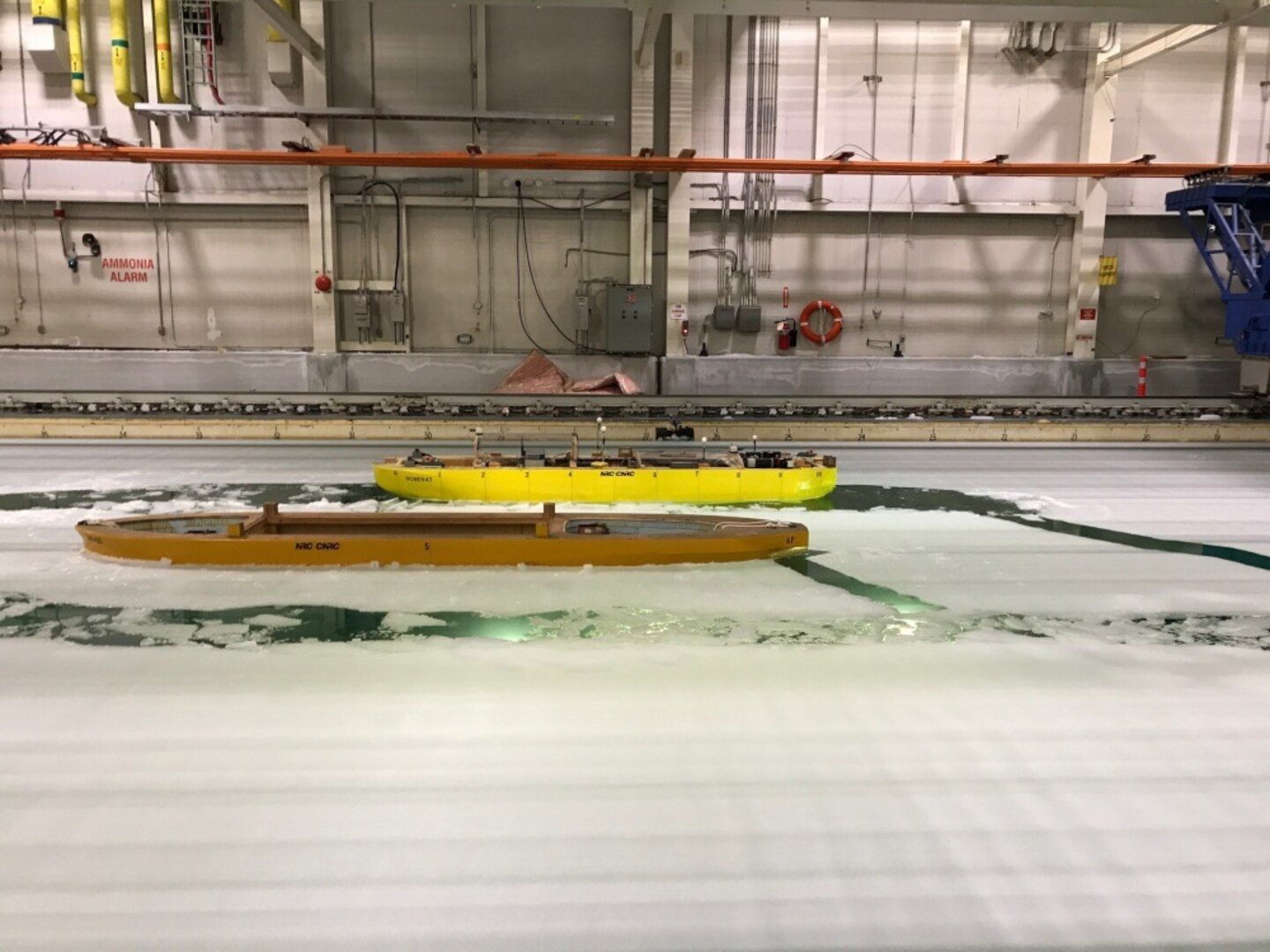 A model icebreaker demonstrates its maneuverability during a test at the National Research Council of Canada's facility in St. Johns, Newfoundland, on July 26, 2017. The test showcased the progress made on the testing and evaluation of design models for the U.S. Coast Guard's icebreaker acquisition program, which is being supported by an international, multiagency team including engineers from Naval Surface Warfare Center, Carderock Division. (U.S. Navy photo by Steven Ouimette/Released)