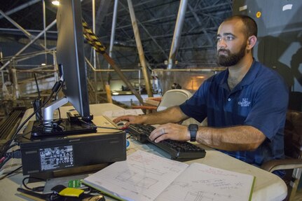 Miguel Quintero, an ocean engineer assigned to Naval Surface Warfare Center, Carderock Division's Model and Testing Branch for Surface Ships, records and analyzes data collected from a wave energy converter being tested in the command's Maneuvering and Seakeeping Basin in West Bethesda, Md., Aug. 3, 2017. This WEC test was the second of its kind done as a knowledge share in collaboration with engineers from Sandia National Laboratory in the MASK as part of an effort to increase the efficiency and amount of power generated and collected by these devices. (U.S. Navy photo by Dustin Q. Diaz/Released)