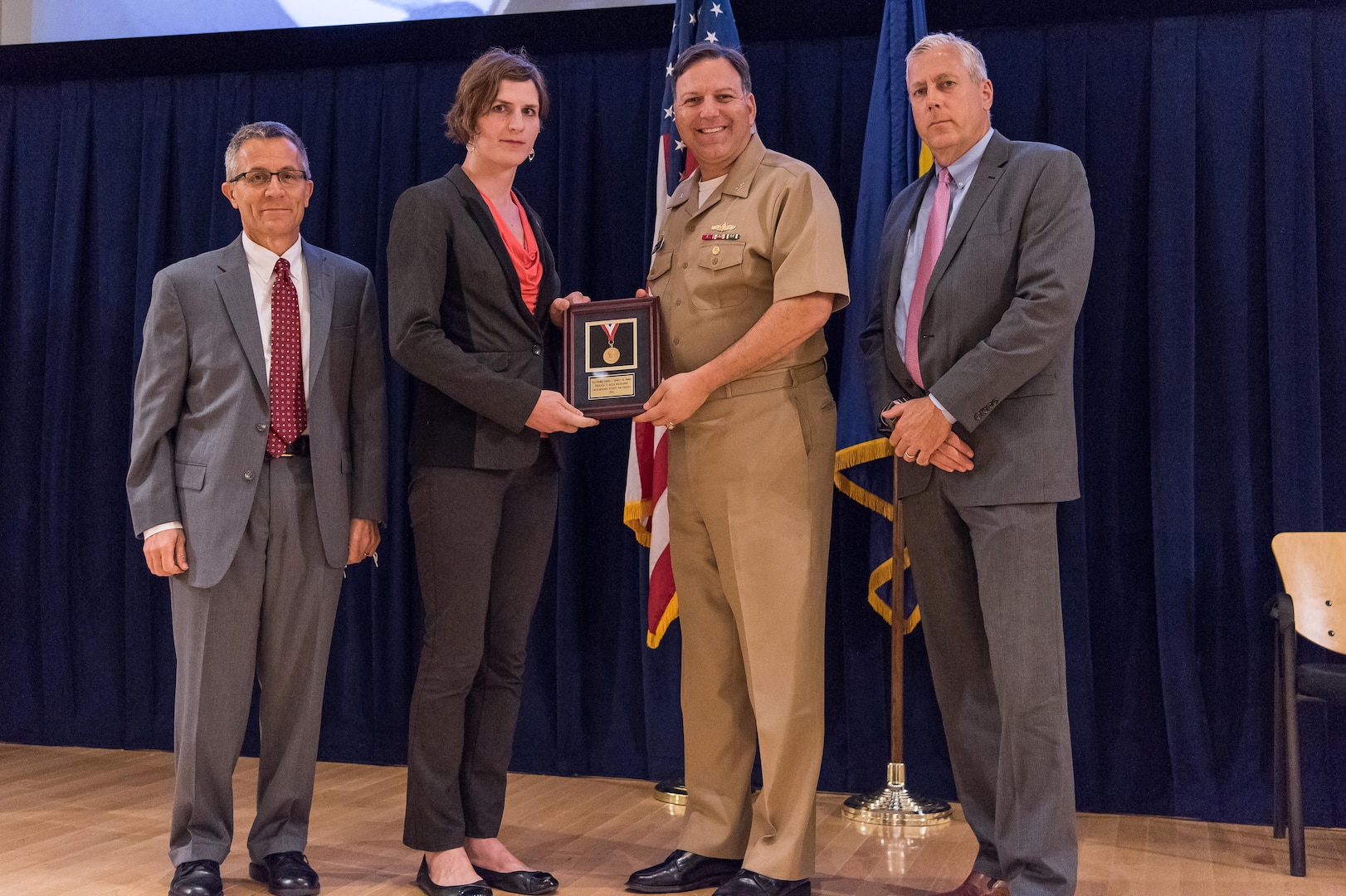 JaeLee Waldschmidt, a Carderock engineer detailed to Naval Sea Systems Command (NAVSEA), receives the Vice Adm. Samuel L. Gravely Jr. Award for achievement in equity and diversity at the Naval Surface Warfare Center, Carderock Division Honor Awards ceremony Aug. 1, 2017, in West Bethesda, Md. From left to right: Technical Director Dr. Tim Arcano, Waldschmidt, Commanding Officer Capt. Mark Vandroff and Naval Architecture and Engineering Department Head Mike Brown. (U.S. Navy photo by Jake Cirksena/Released)