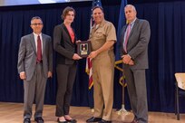 JaeLee Waldschmidt, a Carderock engineer detailed to Naval Sea Systems Command (NAVSEA), receives the Vice Adm. Samuel L. Gravely Jr. Award at the Naval Surface Warfare Center, Carderock Division Honor Awards ceremony Aug. 1, 2017, in West Bethesda, Md. From left to right: Technical Director Dr. Tim Arcano, Waldschmidt, Commanding Officer Capt. Mark Vandroff and Naval Architecture and Engineering Department Head Mike Brown. (U.S. Navy photo by Jake Cirksena/Released)