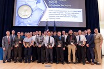 The Littoral Combat Ship (LCS) Full-Ship Shock Trials Team receives the Rear Adm. Benjamin F. Isherwood Award for exceptional fleet support at the Naval Surface Warfare Center, Carderock Division Honor Awards ceremony Aug. 1, 2017, in West Bethesda, Md. About 40 employees from Carderock's Survivability, Structures, Materials and Environmental Department were part of the team, which was led by Henry Joseph (Joe) Venne, branch head for the Underwater Explosion (UNDEX) and Trials Program Office. (U.S. Navy photo by Jake Cirksena/Released)