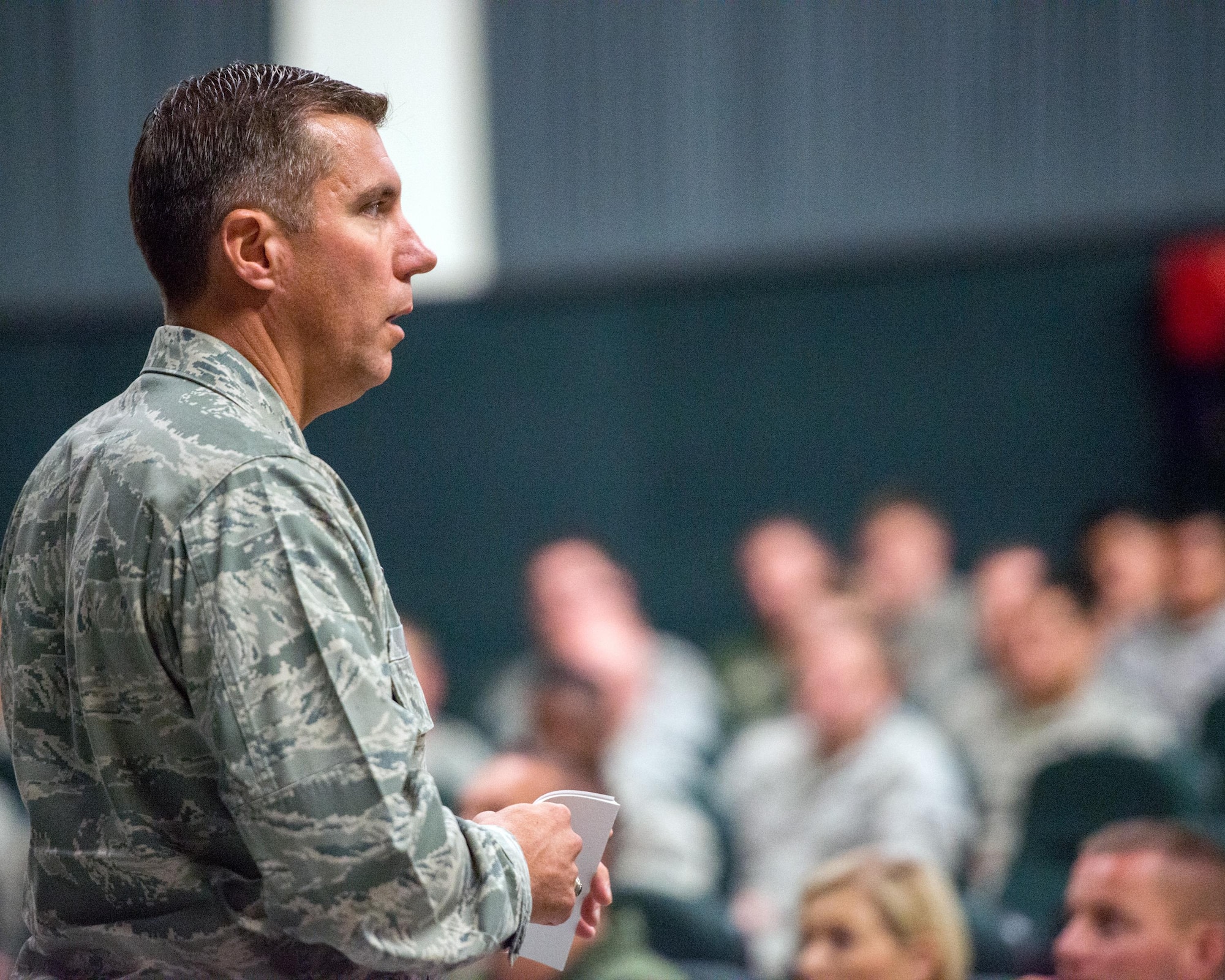 U.S. Air Force Col. John Klein, 60th Air Mobility Wing commander, gives a briefing during his commander’s call at Travis Air Force Base, Calif., August 8, 2017. Klein discussed a variety of topics to include safety, projecting American power and how every Airmen fits into the mission. (U.S. Air Force photo by Louis Briscese)