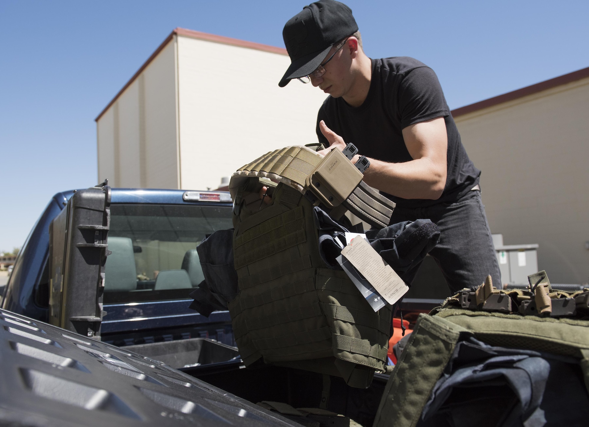 U.S. Air Force Survival, Evasion, Resistance and Escape instructors and augmentees prepare for a training session for aircrew members that will last well into the evening in a remote area near Travis Air Force Base, Calif., Jul. 17, 2017.
